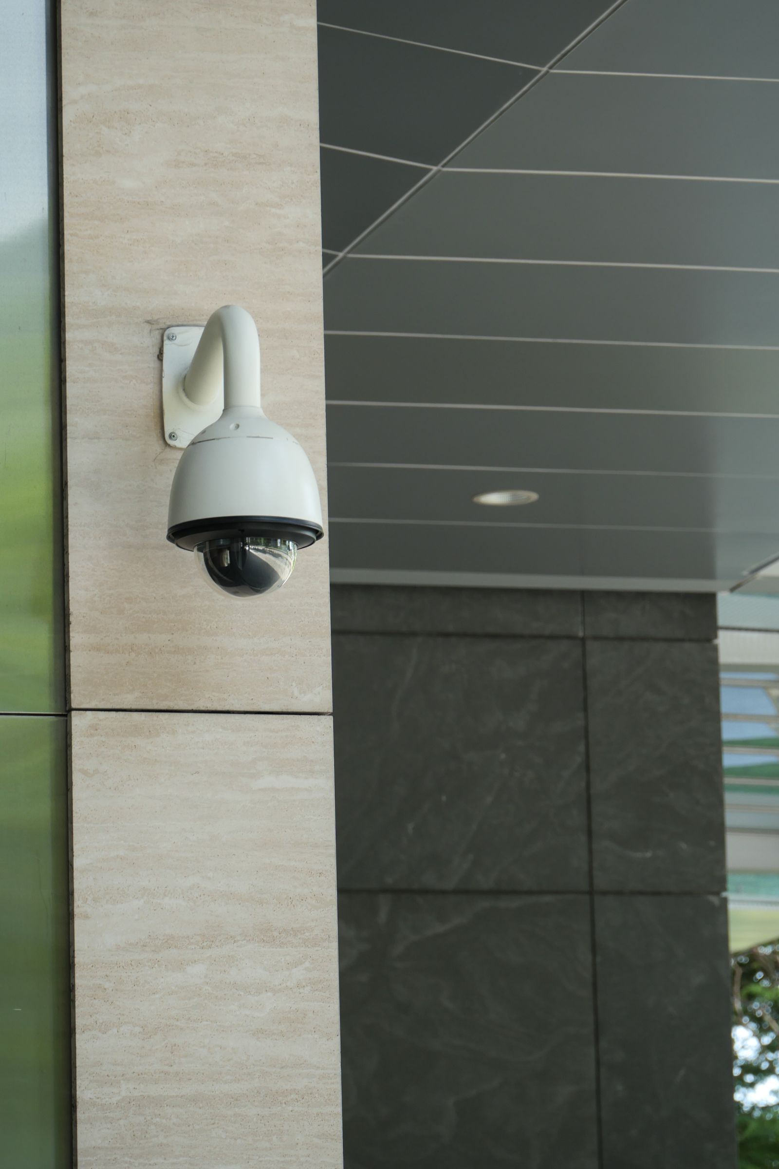 Dome CCTV camera mounted on the outside of a building.